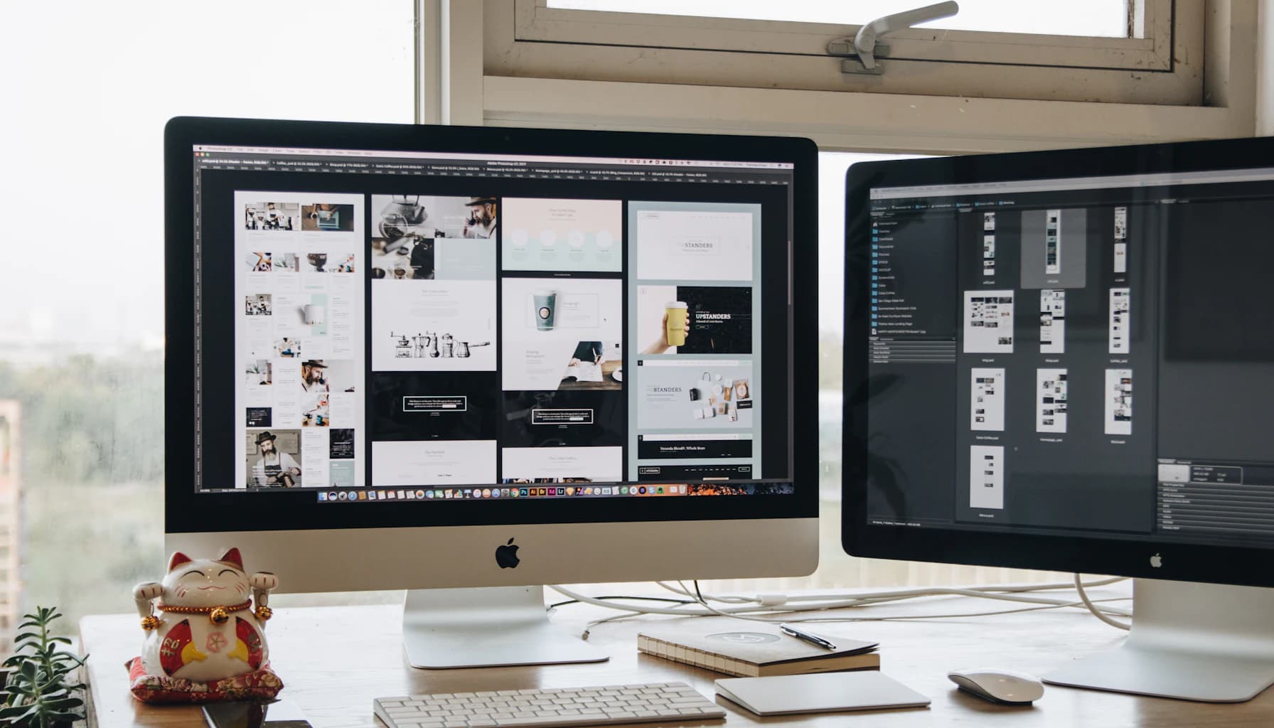 Two monitors setup next to each other on a computer desk.
